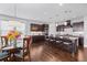 Beautiful kitchen with dark wood cabinetry, stainless steel appliances, and a spacious center island with bar seating at 326 Still Pine Bnd, Smyrna, GA 30082