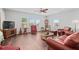 Cozy living room with comfortable seating, ample lighting, and hardwood floors at 326 Still Pine Bnd, Smyrna, GA 30082