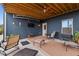 Cozy covered patio with outdoor seating and a ceiling fan; perfect for entertaining at 326 Still Pine Bnd, Smyrna, GA 30082