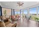 Inviting sunroom with lots of windows, comfortable seating, and beautiful outdoor views at 326 Still Pine Bnd, Smyrna, GA 30082