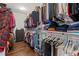 Spacious walk-in closet featuring shelving and clothing racks for storage and organization at 326 Still Pine Bnd, Smyrna, GA 30082