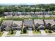 Beautiful aerial view of a residential neighborhood showcasing well-maintained homes, green trees, and manicured lawns at 4452 Thach Ave, Sugar Hill, GA 30518