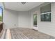 Relaxing covered back porch with wood decking, ideal for outdoor entertaining at 4452 Thach Ave, Sugar Hill, GA 30518