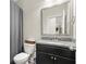 Well-appointed bathroom featuring a granite vanity and shower/tub combination at 4452 Thach Ave, Sugar Hill, GA 30518