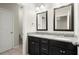 Modern bathroom featuring dual sinks, granite countertops, and black vanities for a sleek design at 4452 Thach Ave, Sugar Hill, GA 30518