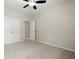 Spacious bedroom with neutral carpet, ceiling fan, and ample closet space for storage and comfort at 4452 Thach Ave, Sugar Hill, GA 30518