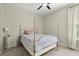 Comfortable bedroom featuring a ceiling fan, neutral paint, and natural light through the window at 4452 Thach Ave, Sugar Hill, GA 30518