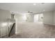 Expansive bonus room with carpet, abundant natural light, and a ceiling fan at 4452 Thach Ave, Sugar Hill, GA 30518