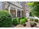Inviting front entrance with stone and brick accents, providing charming curb appeal at 4452 Thach Ave, Sugar Hill, GA 30518