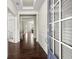 Elegant foyer with hardwood floors, white wainscoting and light-filled open layout at 4452 Thach Ave, Sugar Hill, GA 30518