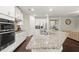 Kitchen features modern appliances, sleek countertops, and ample cabinet space at 4452 Thach Ave, Sugar Hill, GA 30518