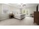 Serene bedroom with tray ceilings and a door to the private covered back porch at 4452 Thach Ave, Sugar Hill, GA 30518