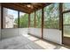 Relax in this screened porch with a ceiling fan and views of trees at 4452 Thach Ave, Sugar Hill, GA 30518