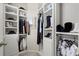 Organized walk-in closet provides ample storage with shelving and hanging space at 4452 Thach Ave, Sugar Hill, GA 30518