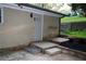 Backyard entrance with steps leading to the house, complemented by fresh landscaping and natural surroundings at 2926 Monterey Dr, Decatur, GA 30032