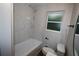 Updated bathroom featuring marble tile, new fixtures, and lots of natural light at 2926 Monterey Dr, Decatur, GA 30032