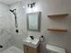 Modern bathroom with mosaic tile, a standalone sink, and open shelving at 2926 Monterey Dr, Decatur, GA 30032