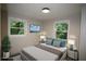 A staged bedroom featuring a comfortable bed, stylish nightstands, and a wall-mounted TV for ultimate relaxation at 2926 Monterey Dr, Decatur, GA 30032