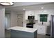 Bright kitchen featuring a modern island, stainless steel appliances, and stylish backsplash at 2926 Monterey Dr, Decatur, GA 30032