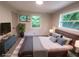 Staged main bedroom with contemporary decor, modern furniture, and plenty of natural light at 2926 Monterey Dr, Decatur, GA 30032