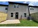 Backyard features a patio, new grass, and a privacy fence at 1115 Lockhart Way, Douglasville, GA 30135