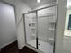 Sleek bathroom showcasing a glass-enclosed shower and built-in shelving at 1115 Lockhart Way, Douglasville, GA 30135