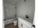 The bathroom features a shower and tub combination and a new vanity at 1115 Lockhart Way, Douglasville, GA 30135