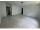 An additional bedroom with light walls and plastic sheeted flooring at 1115 Lockhart Way, Douglasville, GA 30135