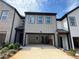 Spacious garage with ample parking space and modern architectural design at 1115 Lockhart Way, Douglasville, GA 30135
