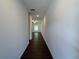 Bright hallway with sleek dark wood flooring, leading to a well-lit room at 1115 Lockhart Way, Douglasville, GA 30135