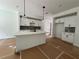 Modern kitchen with white cabinets, an island, and stainless-steel appliances at 1115 Lockhart Way, Douglasville, GA 30135