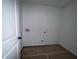 The laundry room features hookups and flooring at 1115 Lockhart Way, Douglasville, GA 30135