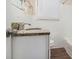 Well-lit bathroom featuring a granite vanity top, white tiled walls and modern fixtures at 2191 Greystone Way, Decatur, GA 30032