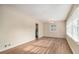 Bright living room featuring sleek hardwood floors, large windows, and neutral paint at 2191 Greystone Way, Decatur, GA 30032