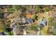 Aerial view of a home with a dark roof surrounded by mature trees and lush landscaping at 275 Cedars, Villa Rica, GA 30180