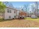 Spacious backyard with a deck, shed, and lush trees at 275 Cedars, Villa Rica, GA 30180