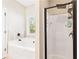 Bathroom featuring a shower and soaking tub, offering a luxurious and relaxing experience at 275 Cedars, Villa Rica, GA 30180