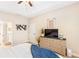 Bedroom boasting vaulted ceiling, adjacent bathroom, tv and dresser, offering comfort and privacy at 275 Cedars, Villa Rica, GA 30180