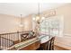 Elegant dining room featuring a wooden table set, chandelier, and bright window at 275 Cedars, Villa Rica, GA 30180