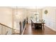 Inviting dining room features a dark wood table set with chandelier lighting at 275 Cedars, Villa Rica, GA 30180