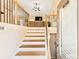 Inviting entryway with wooden staircase and a view of the living room at 275 Cedars, Villa Rica, GA 30180
