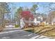 Charming two-story home with white siding, wood shutters, a large front yard, and mature trees at 275 Cedars, Villa Rica, GA 30180