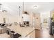 Open kitchen featuring granite counters, stainless appliances, breakfast bar, and adjoining living area at 275 Cedars, Villa Rica, GA 30180
