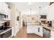 Open concept kitchen showcasing granite countertops, stainless steel appliances, and bright lighting at 275 Cedars, Villa Rica, GA 30180