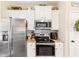 Modern kitchen featuring stainless appliances, white cabinetry, and ample counter space for cooking at 275 Cedars, Villa Rica, GA 30180