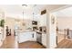 Bright and airy kitchen with granite countertops, stainless steel appliances, and an open layout to living space at 275 Cedars, Villa Rica, GA 30180