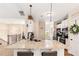 Modern kitchen with granite countertops, stainless steel appliances, and breakfast bar with pendant lighting at 275 Cedars, Villa Rica, GA 30180