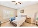 Comfortable main bedroom with a ceiling fan and natural light from the window at 275 Cedars, Villa Rica, GA 30180