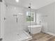 Contemporary bathroom with walk-in shower and soaking tub, perfect for a spa-like experience at 5341 Stewart Mill Rd, Douglasville, GA 30135