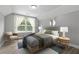 Bedroom with a large window, neutral color scheme, and stylish decor at 5341 Stewart Mill Rd, Douglasville, GA 30135